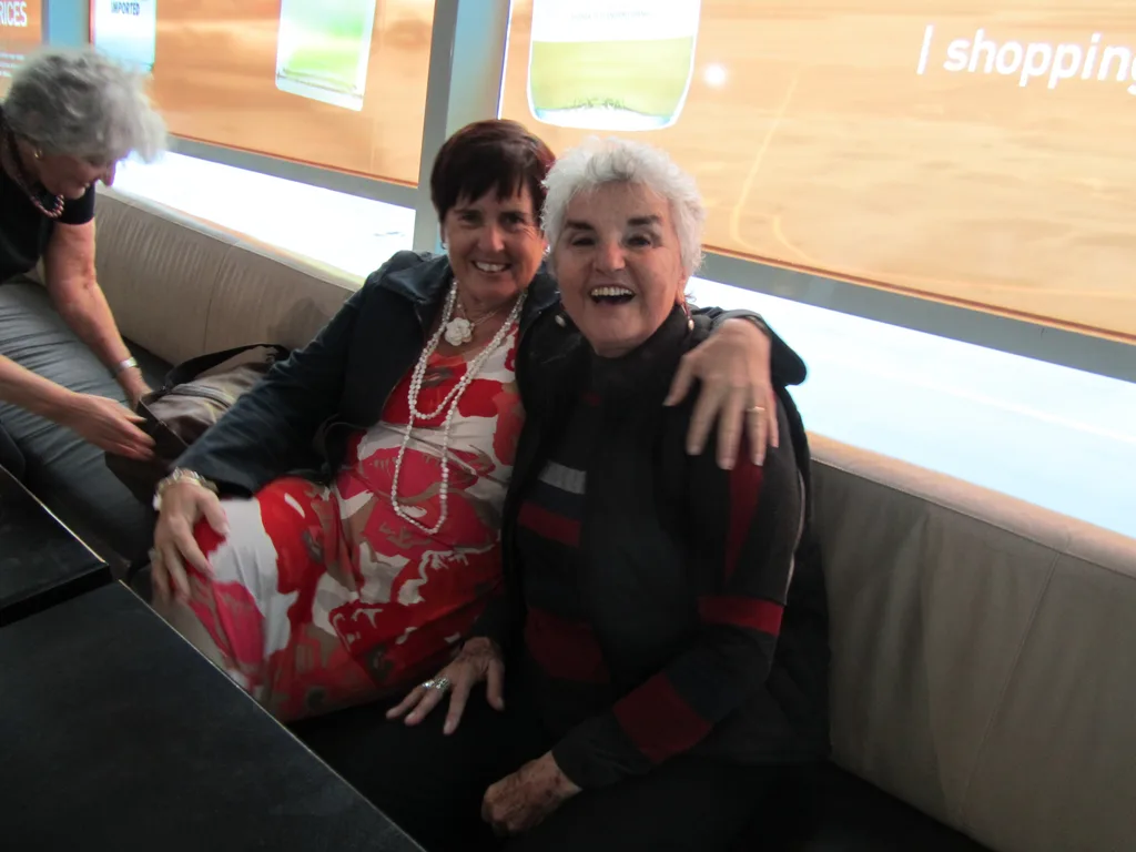Two women sitting and hugging