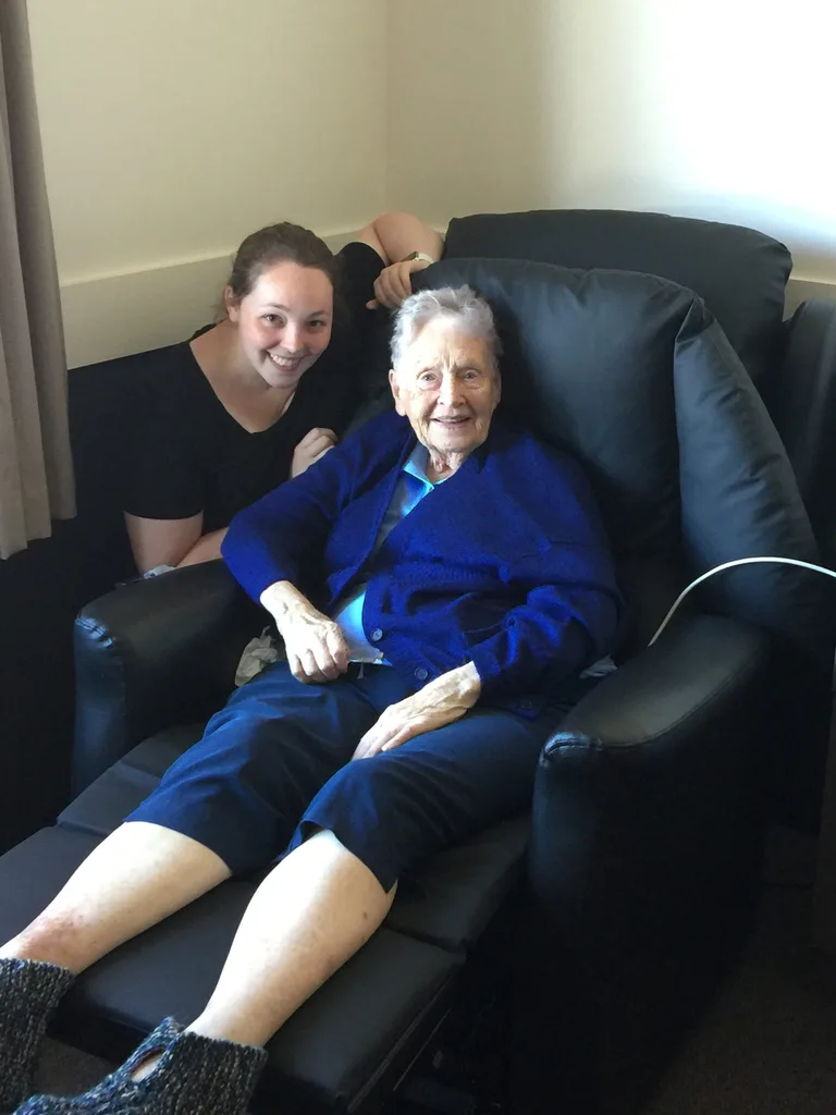 Image of woman sitting with her grandmother