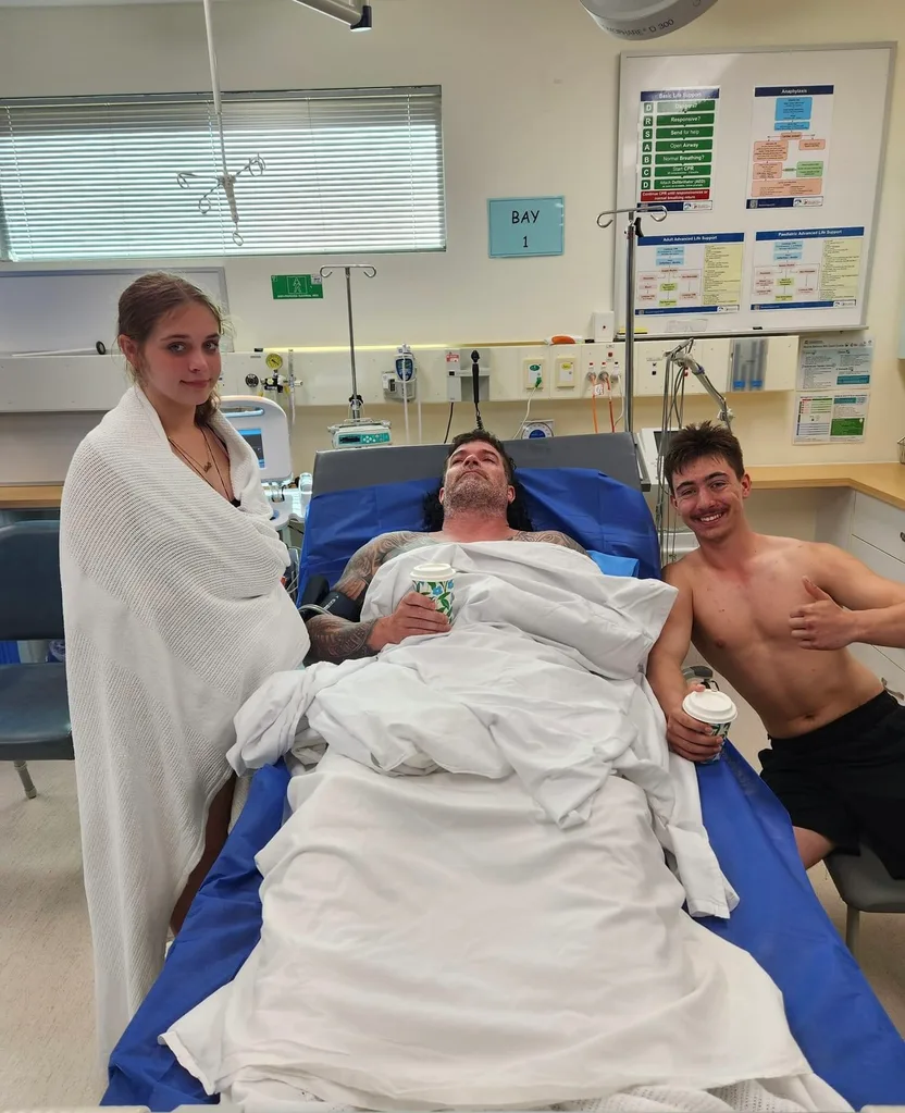 Image of man and two children recovering in hospital after drowning