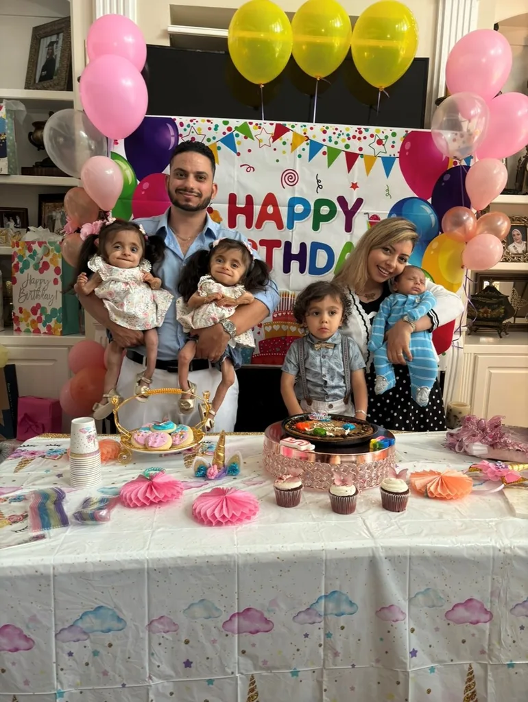 A Mum and Dad celebrating a birthday with their young family