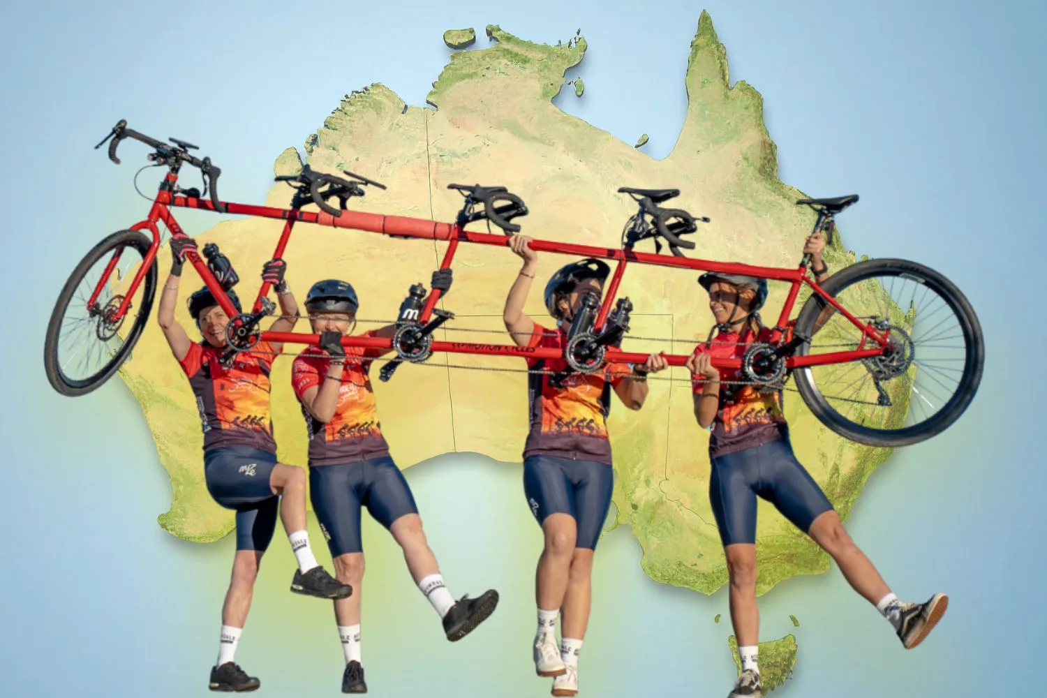 The four women with Ruby the quad tandem bike. In the background is a map of Australia.