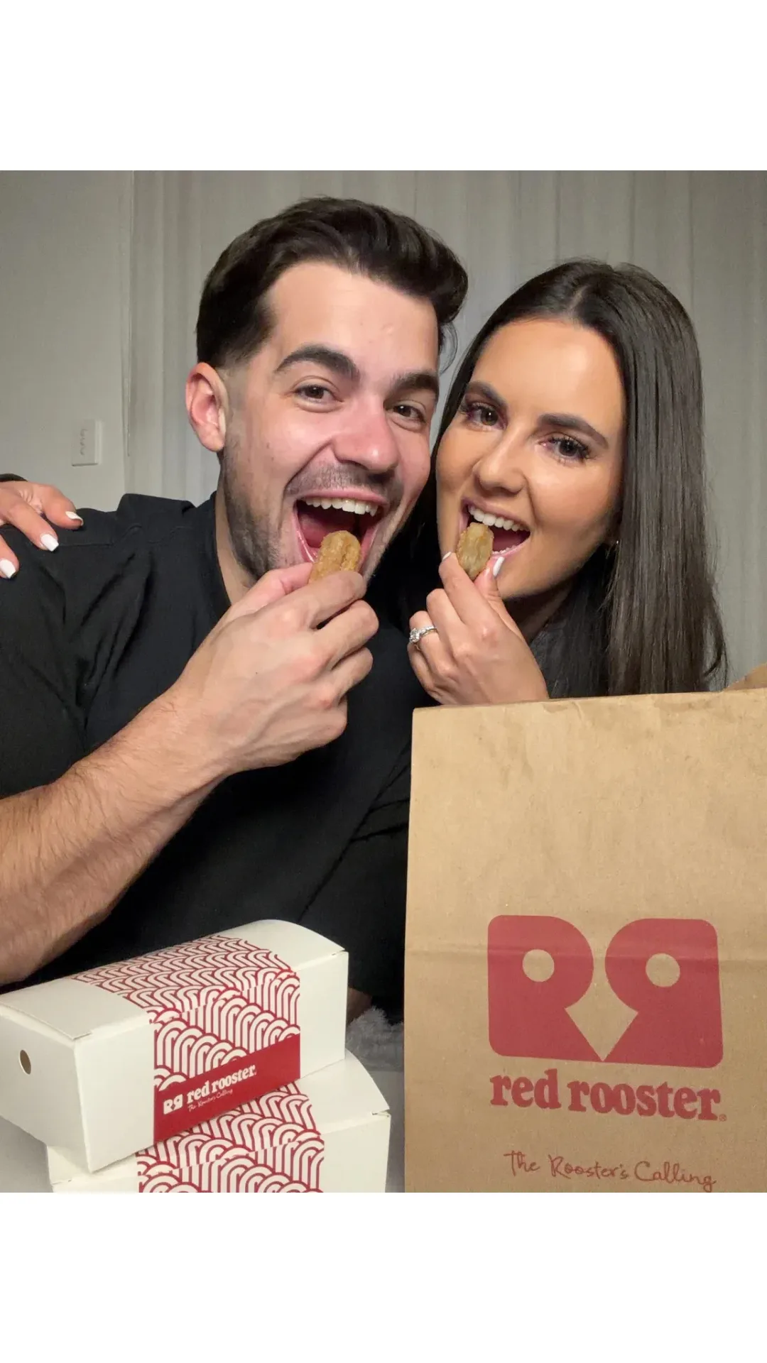 A couple takes a bite of Red Rooster's Choc Churro Bites.