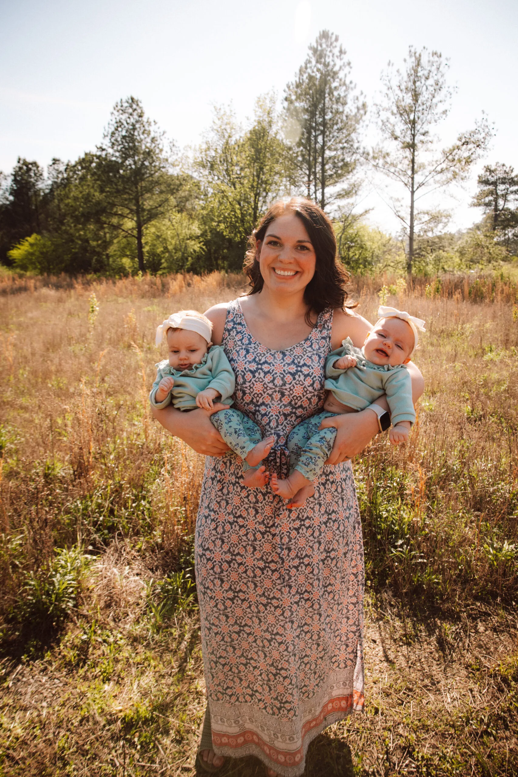 mum holding two babies 