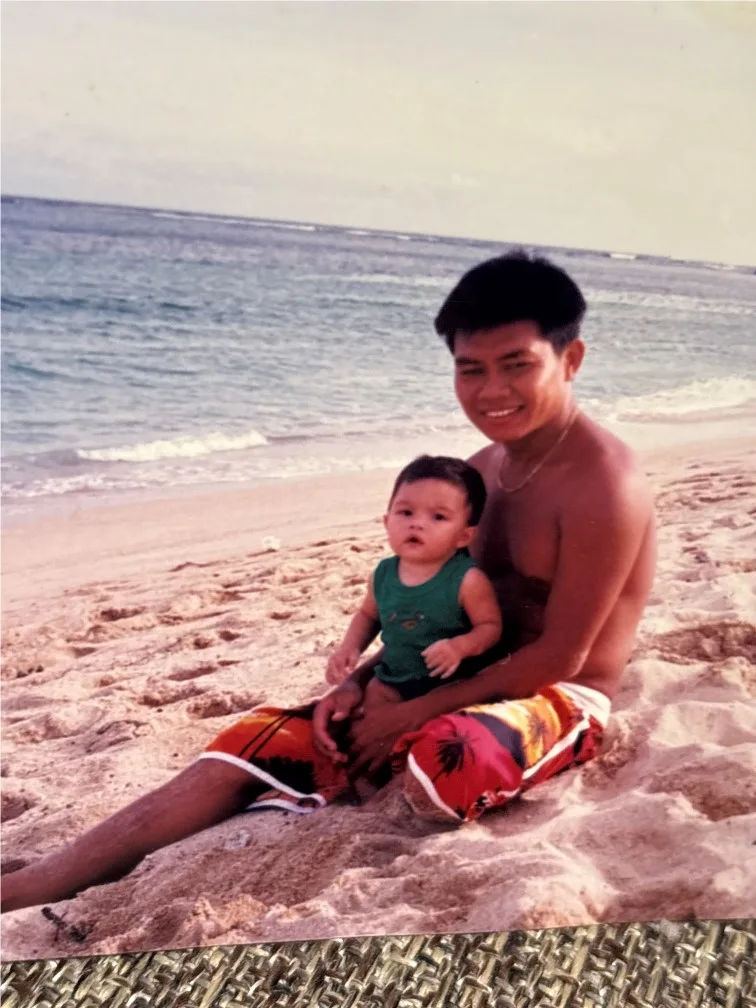 Image of father and son at the beach