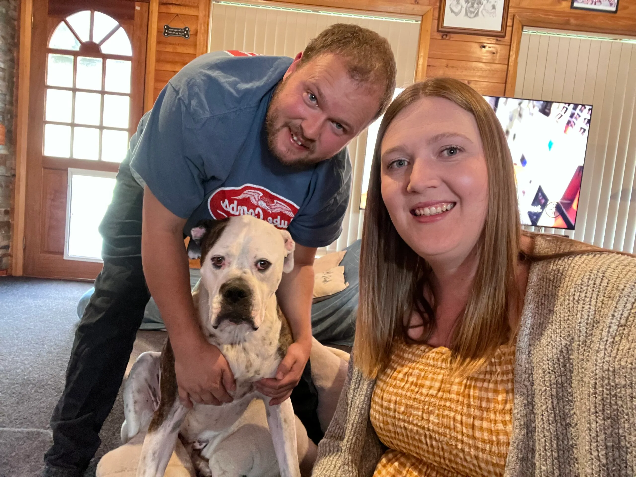 Image of husband, wife and bulldog