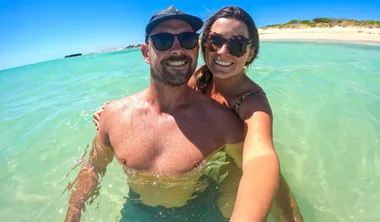 Man and woman in smiling in the sea