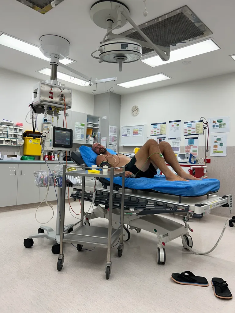 Man in hospital on a trolley