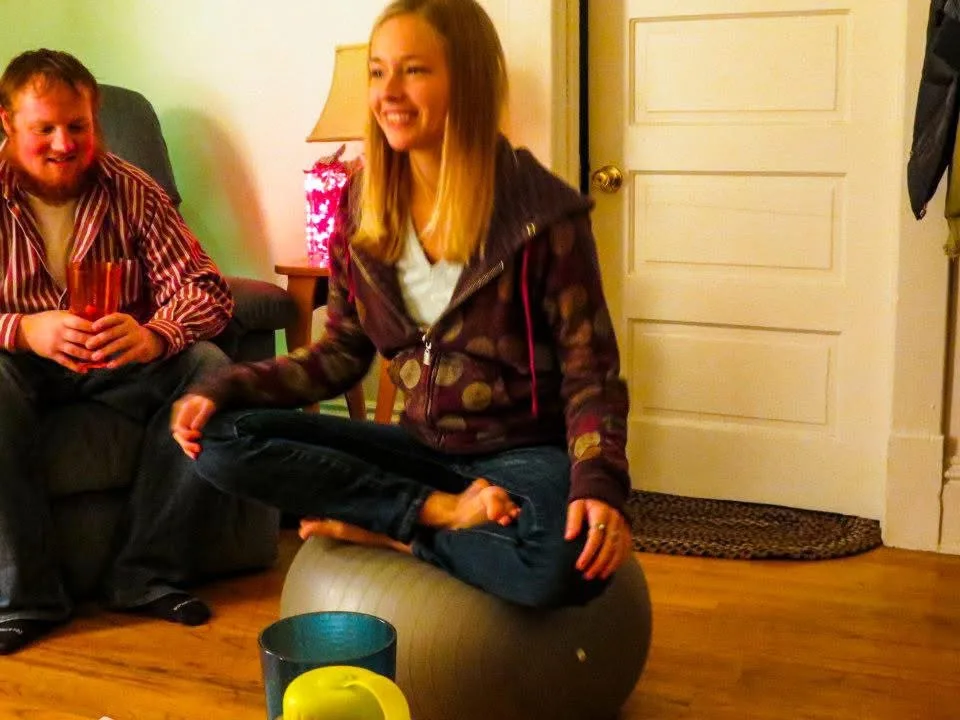 Christopher Thomas and Samantha sitting in a room