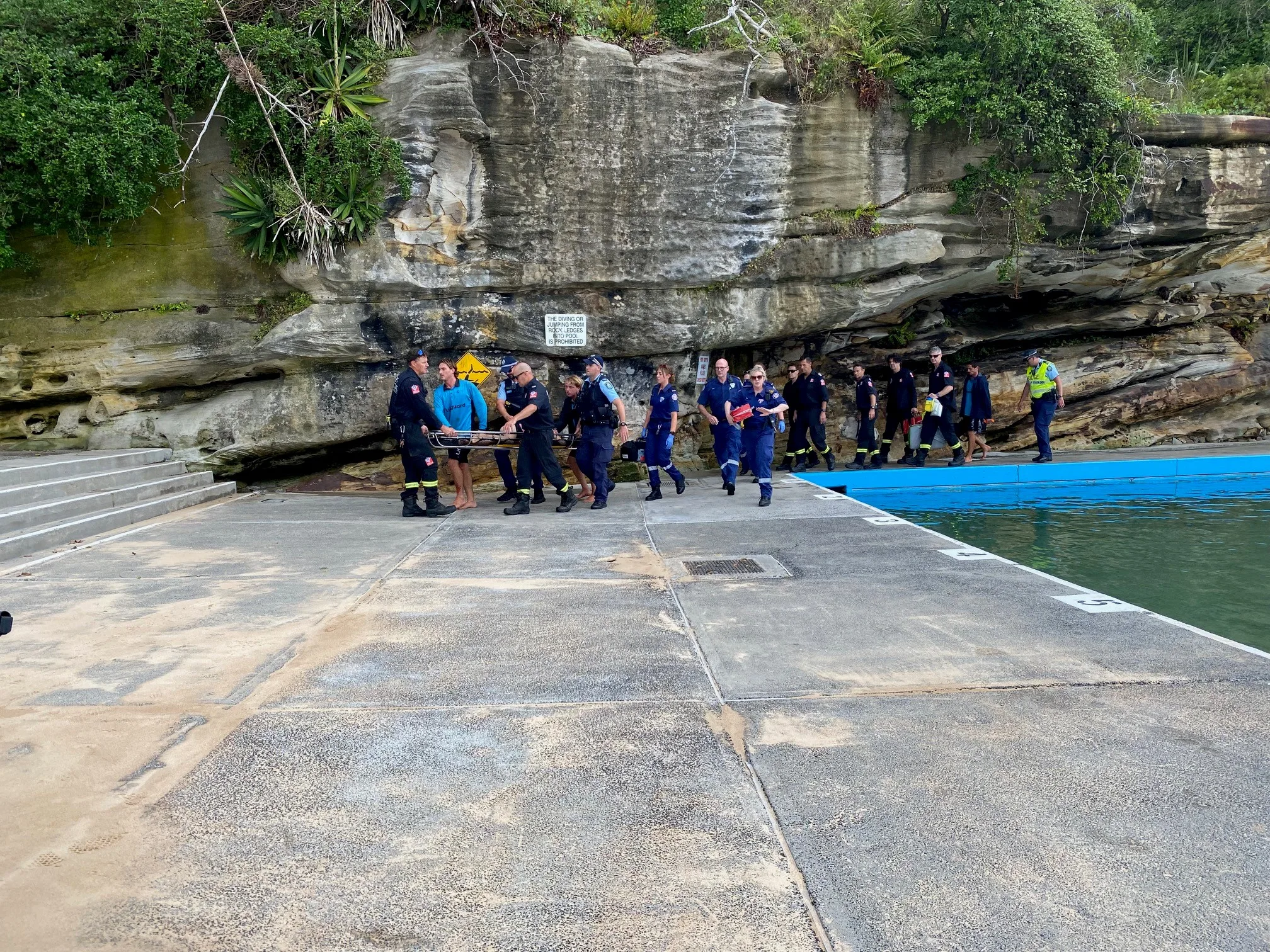 many people surrounding boy 