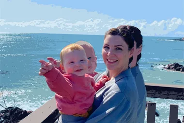 Alexandria De Re holding her son Joey at the beach