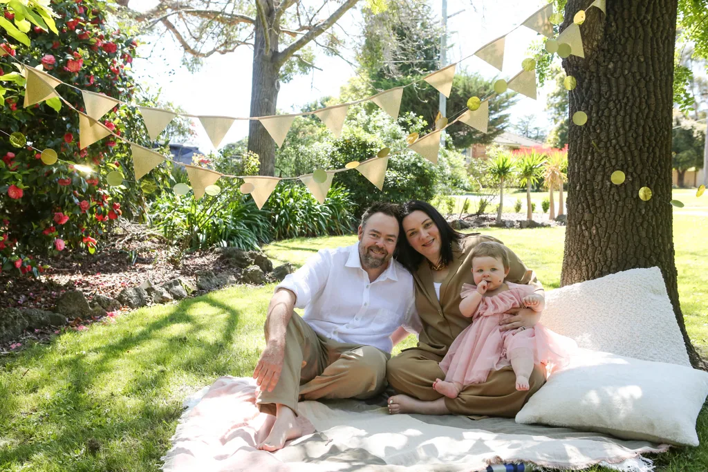 Image of mother, father and toddler.