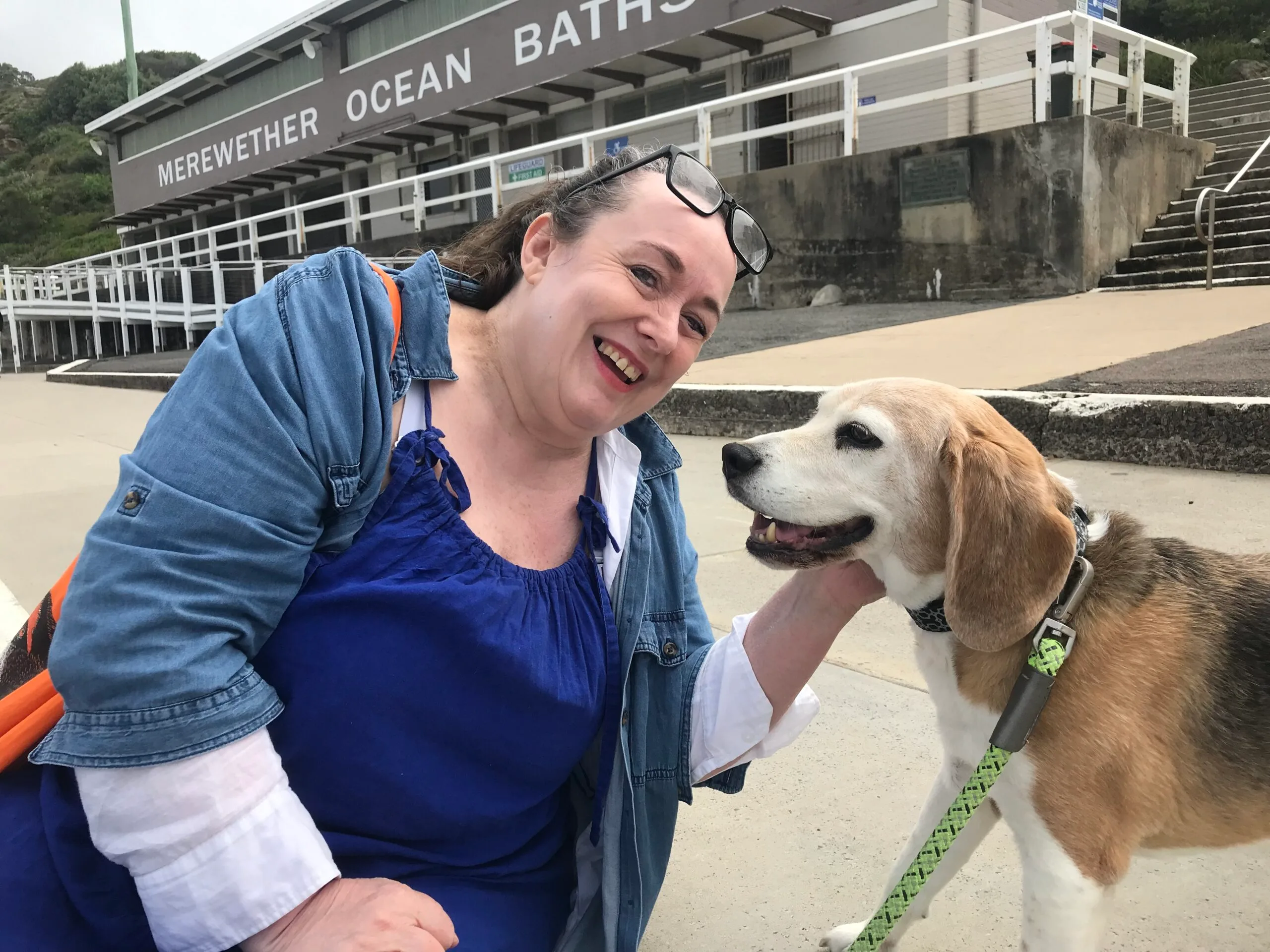 woman happy and smiling with her beagle