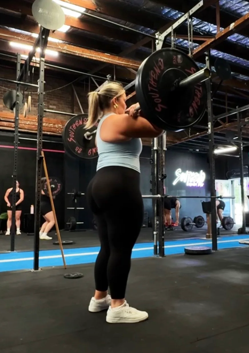 Ailish lifting weight at the gym