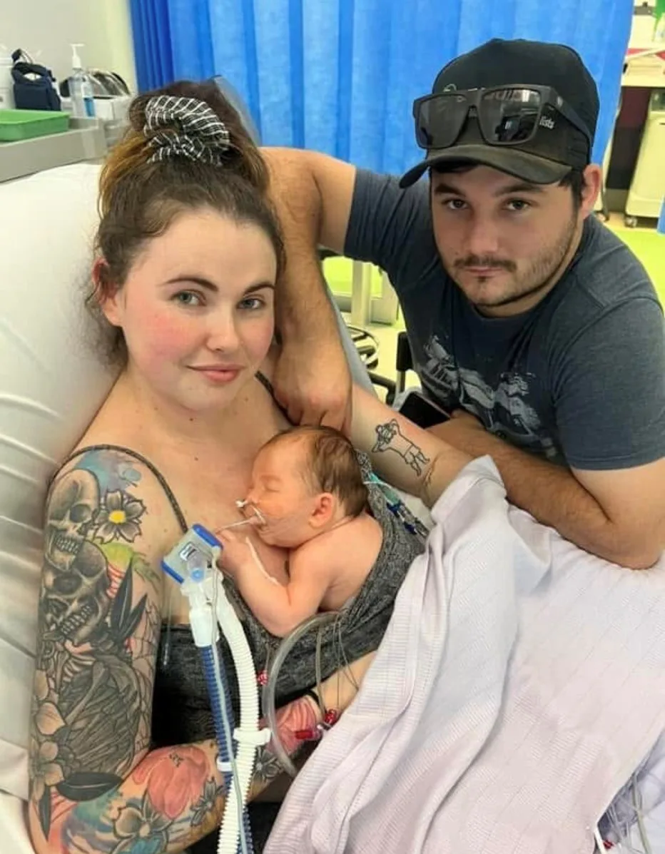 Tayla (left) and Cougar (right) with their little one, Koa