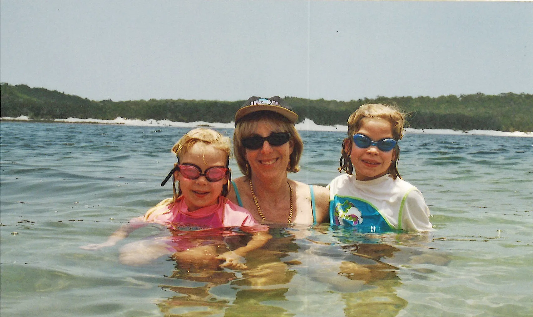 Alyssa with her twin sister Rhiannon and her mum (centre) 