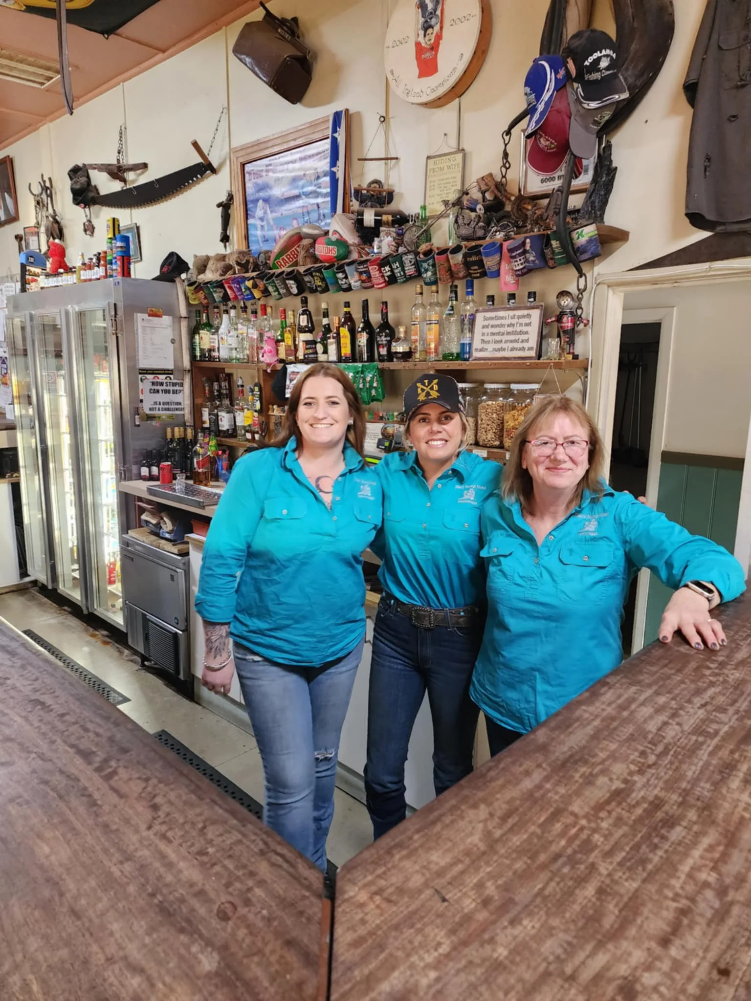 Bar server Kate (pictured left), Laura (pictured centre) and Black Stump landlady Sharon (pictured right)