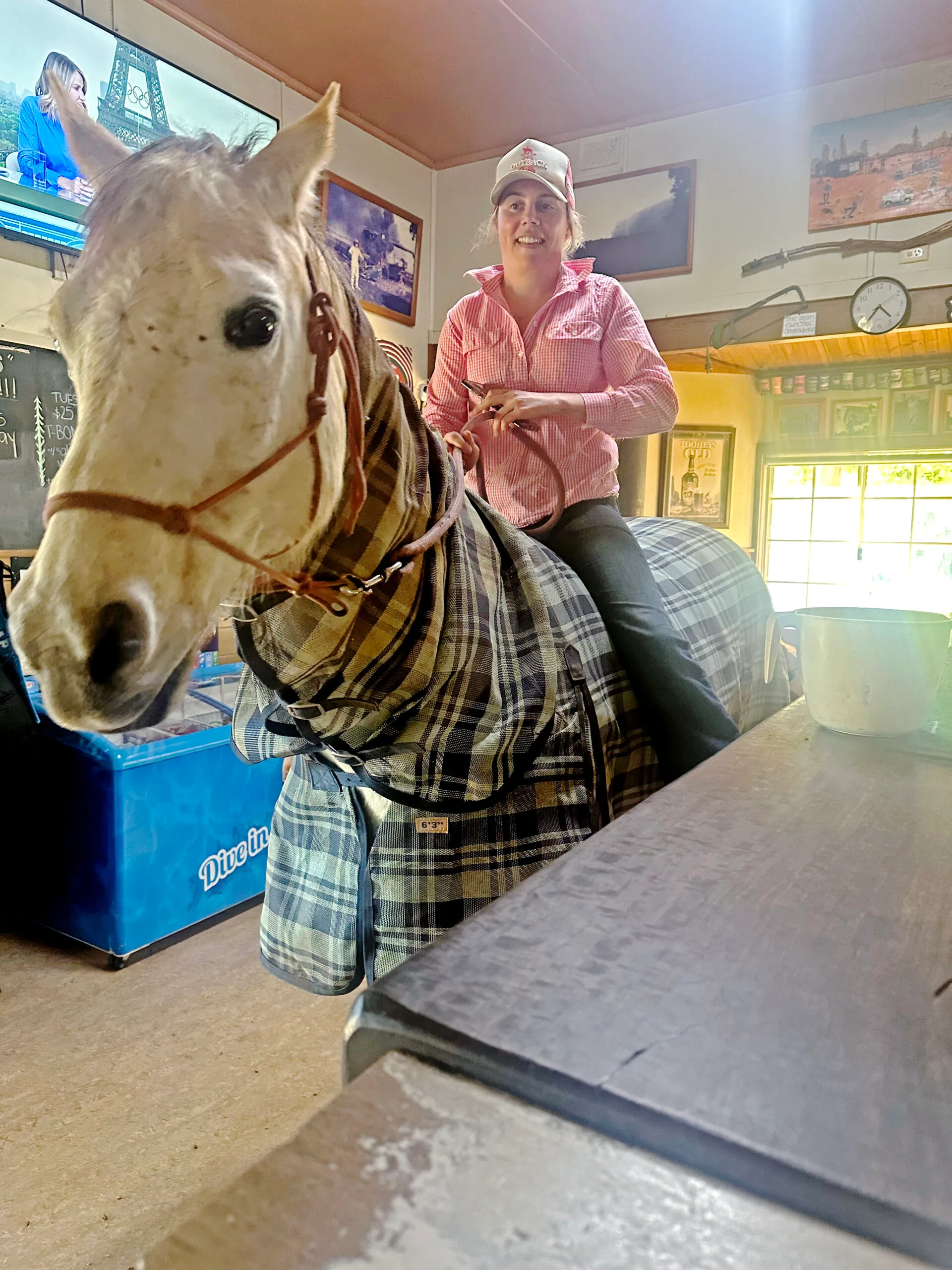 Laura Spence and her horse Larry inside the Black Stump Hotel.