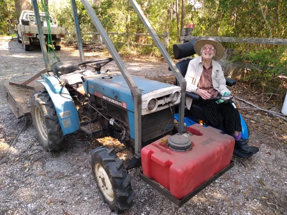 Mary (pictured) with her tractor has lived on her sprawling property for 46 years