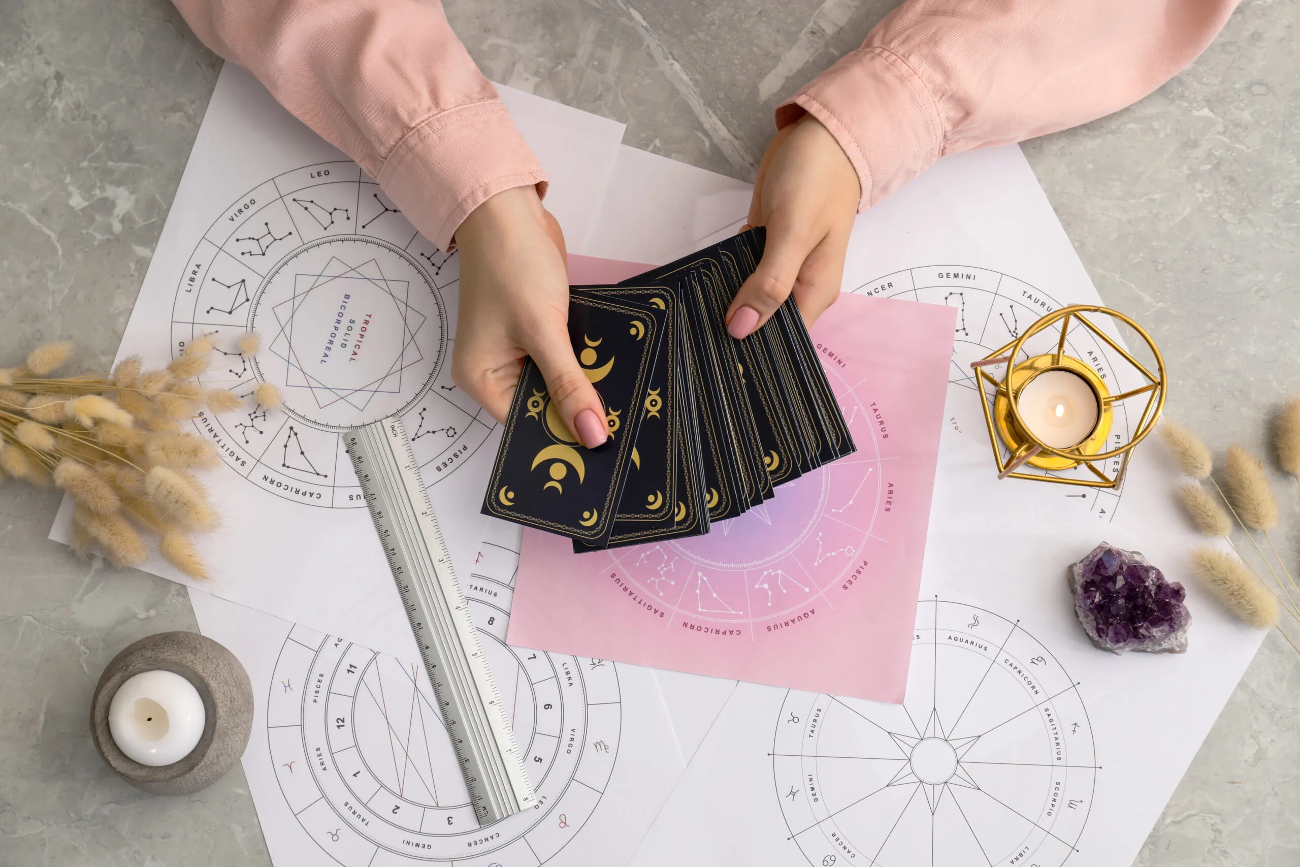 woman holding tarot cards