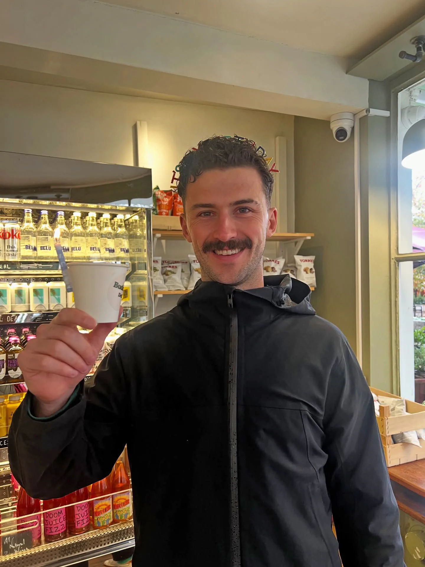 a man holding a coffee cup