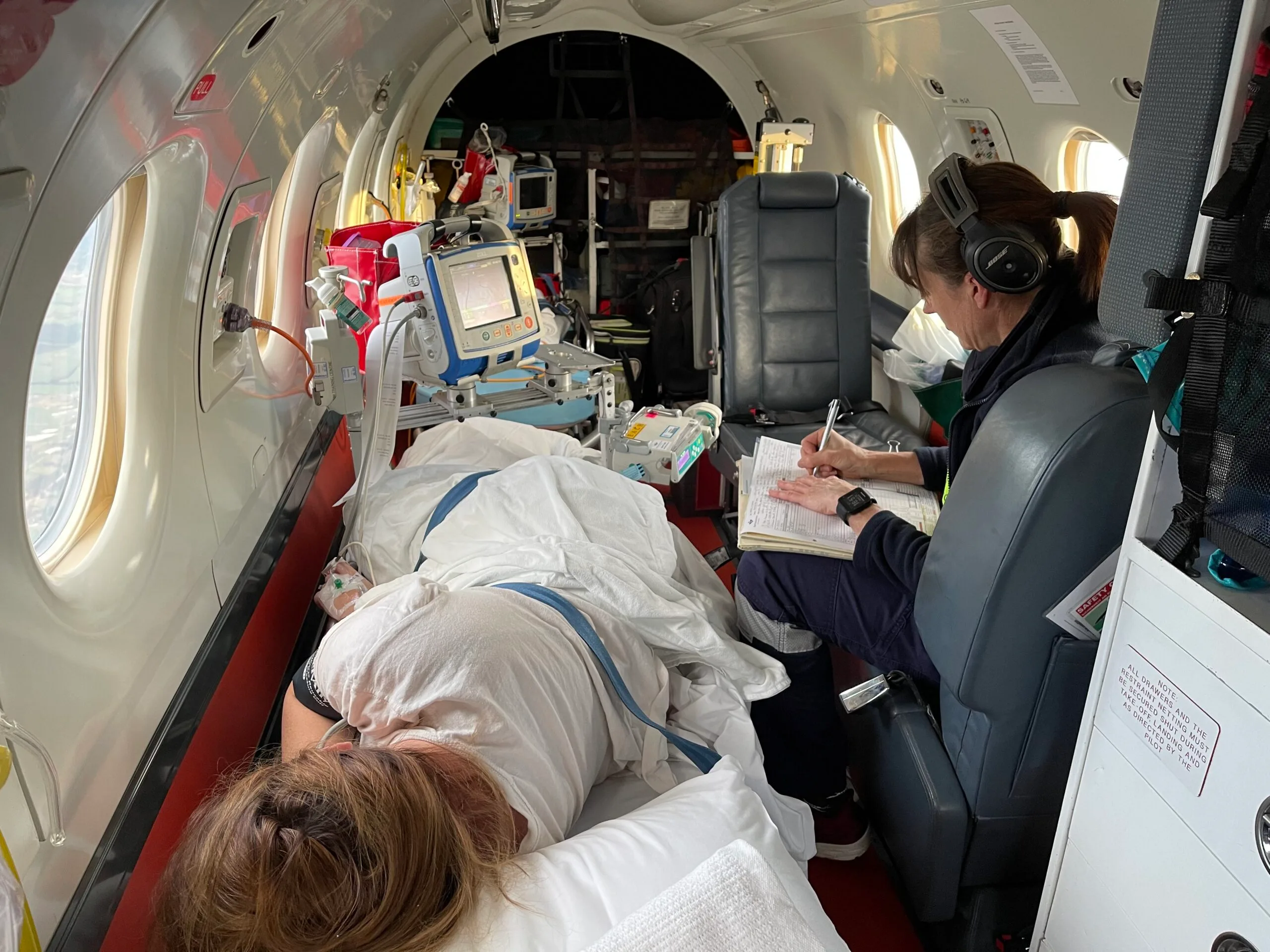 Image of pregnant woman in the RFDS plane
