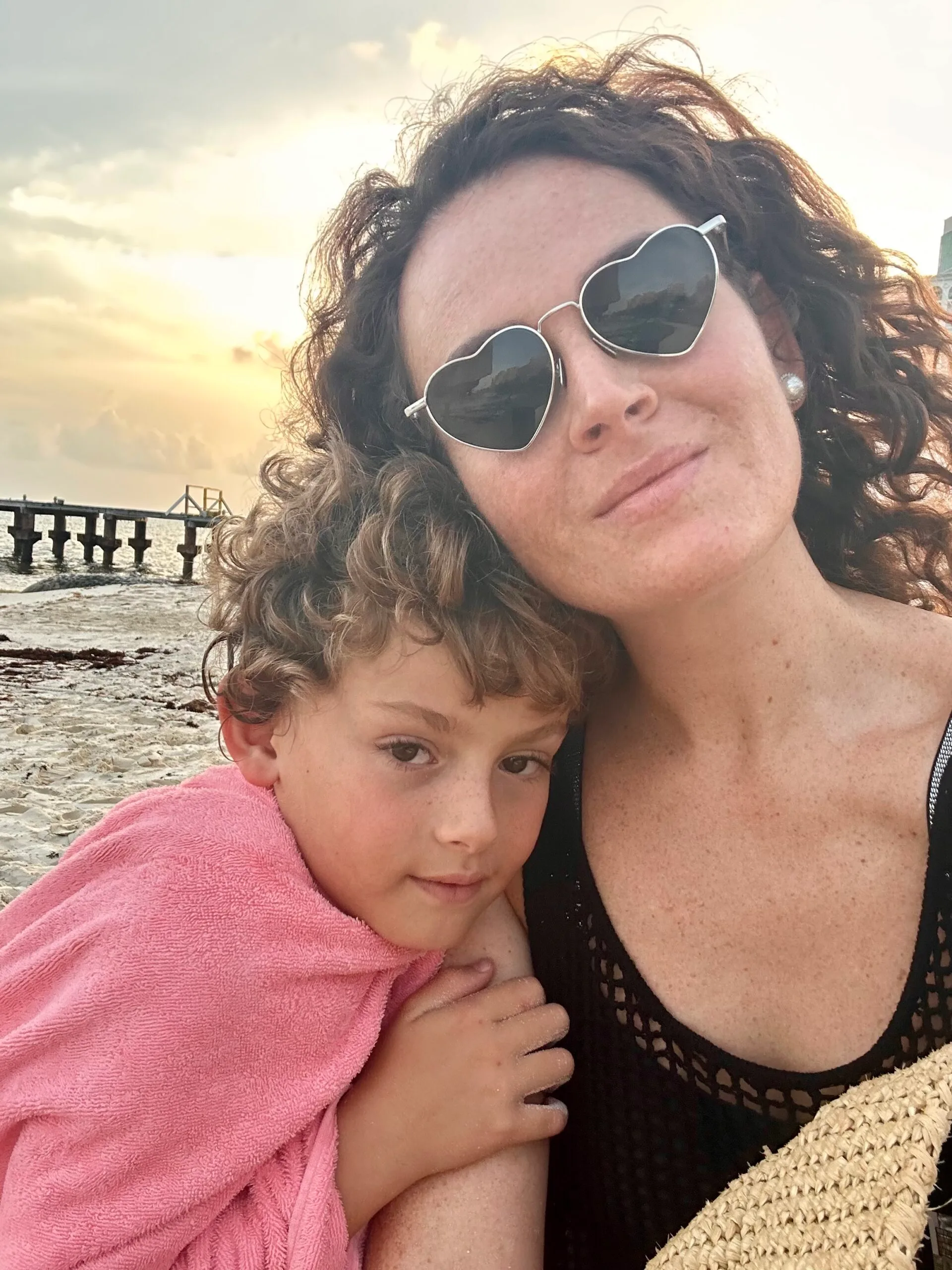 mum and son together on beach 