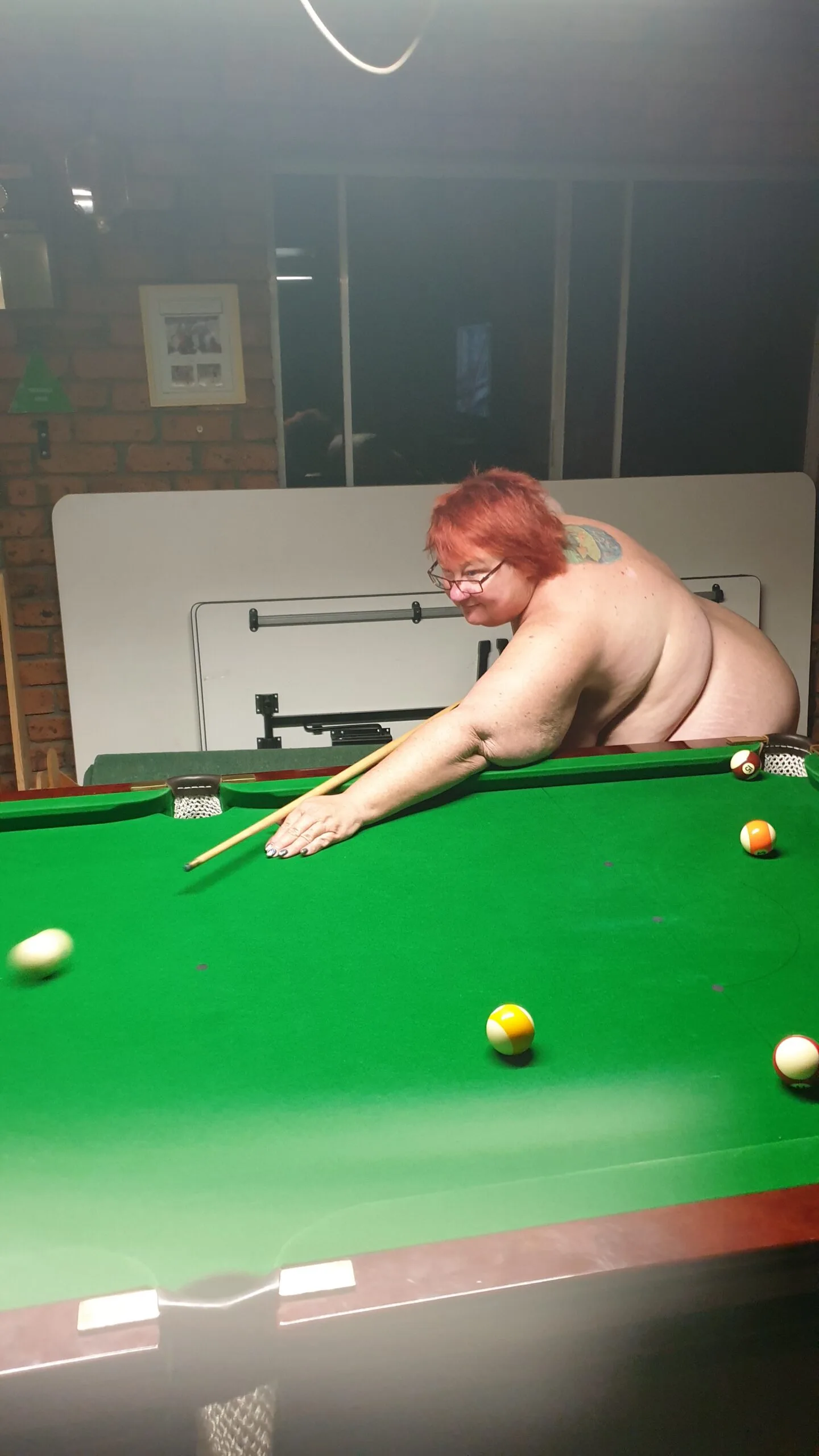 Shazz playing pool at Tindo club
