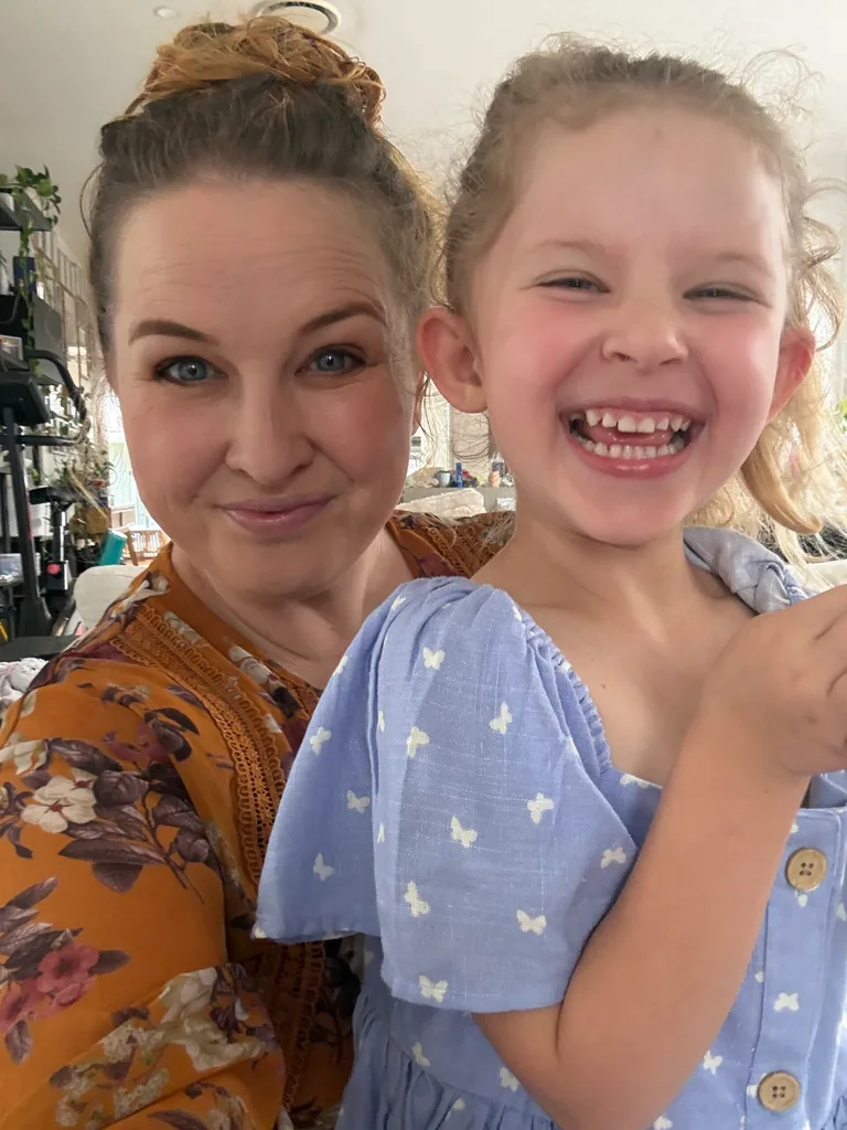 Image of mum and daughter smiling
