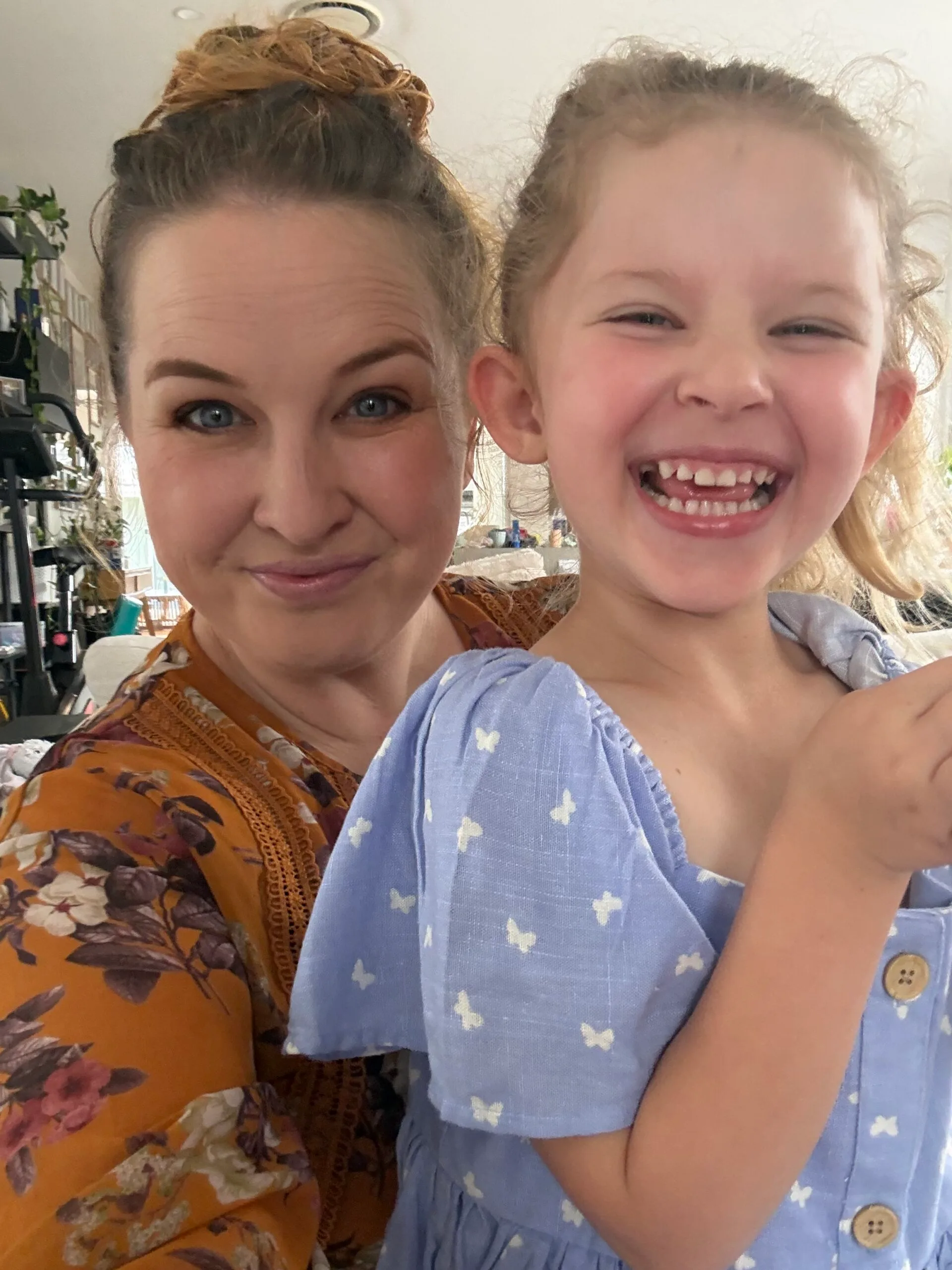Image of mum and daughter smiling