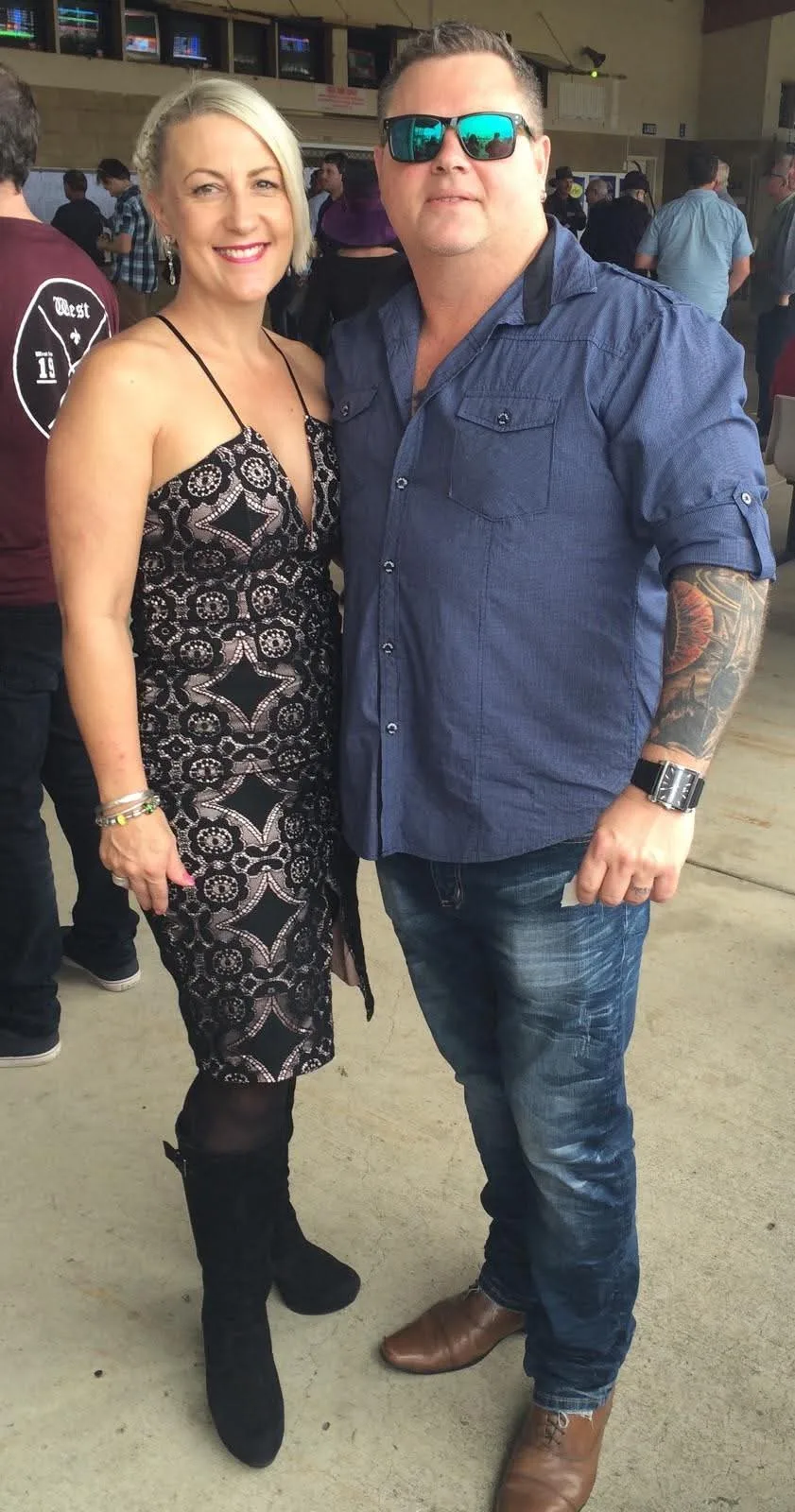 man and woman arm in arm outside