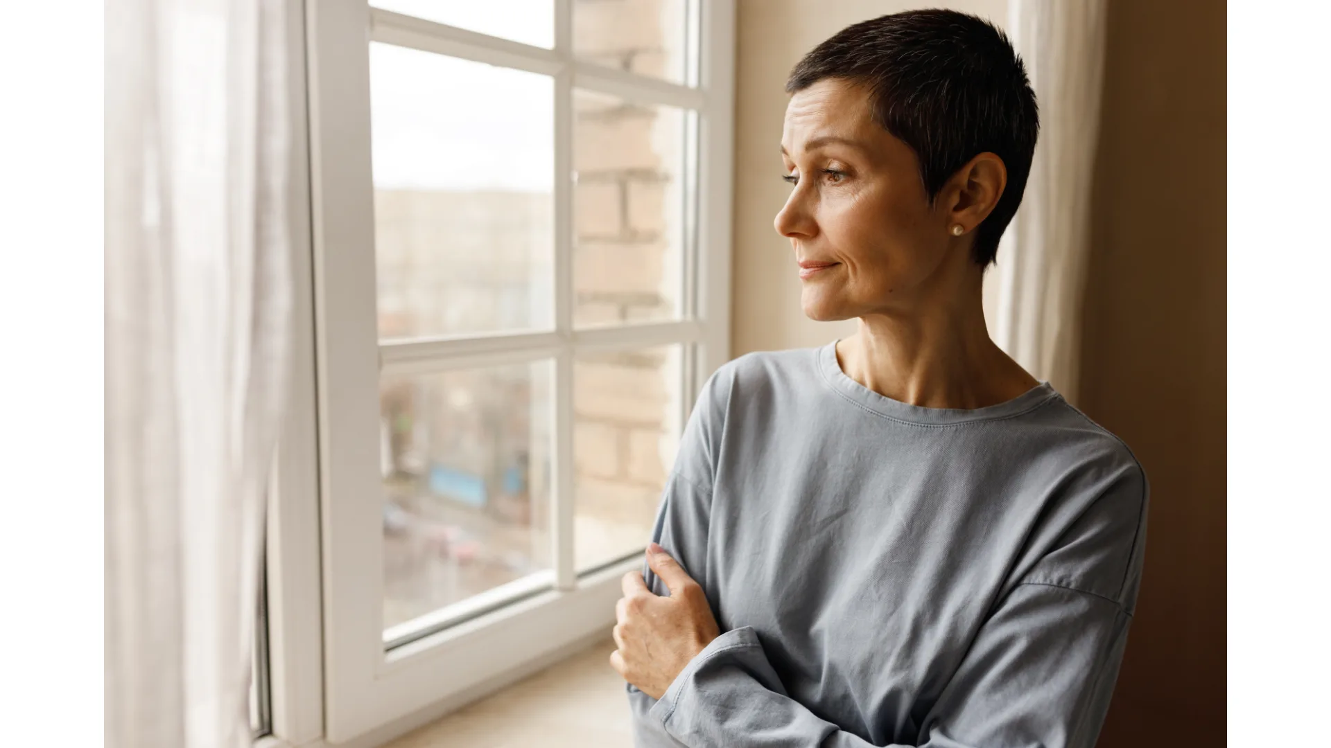 A woman stares out the window.