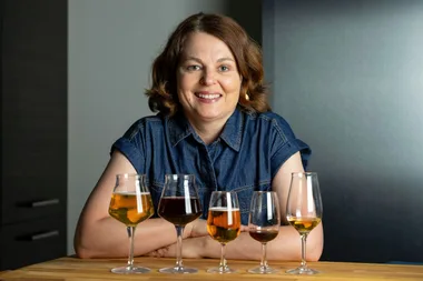 Briony in front of a range of different beers to taste