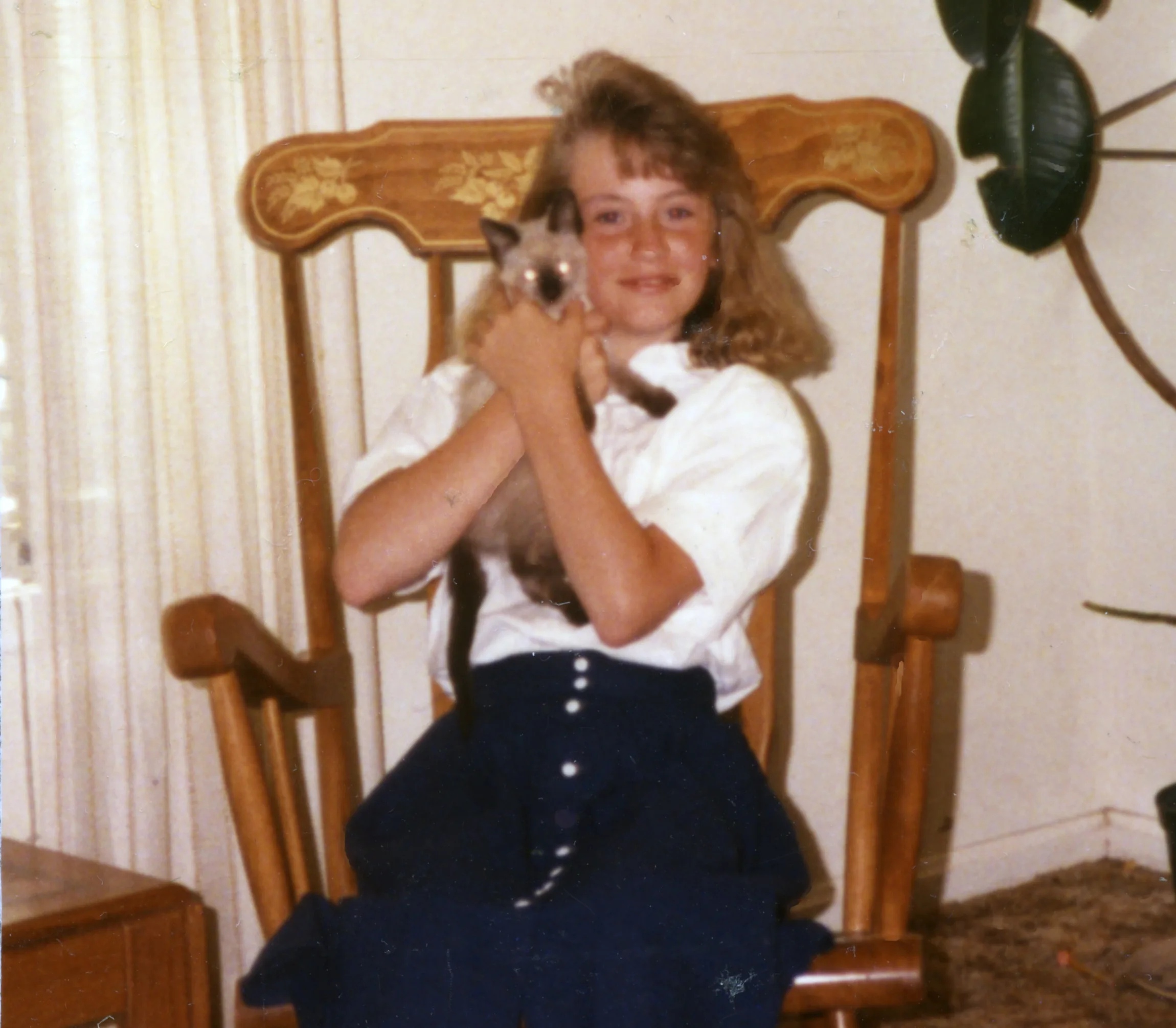 young girl holding a cat