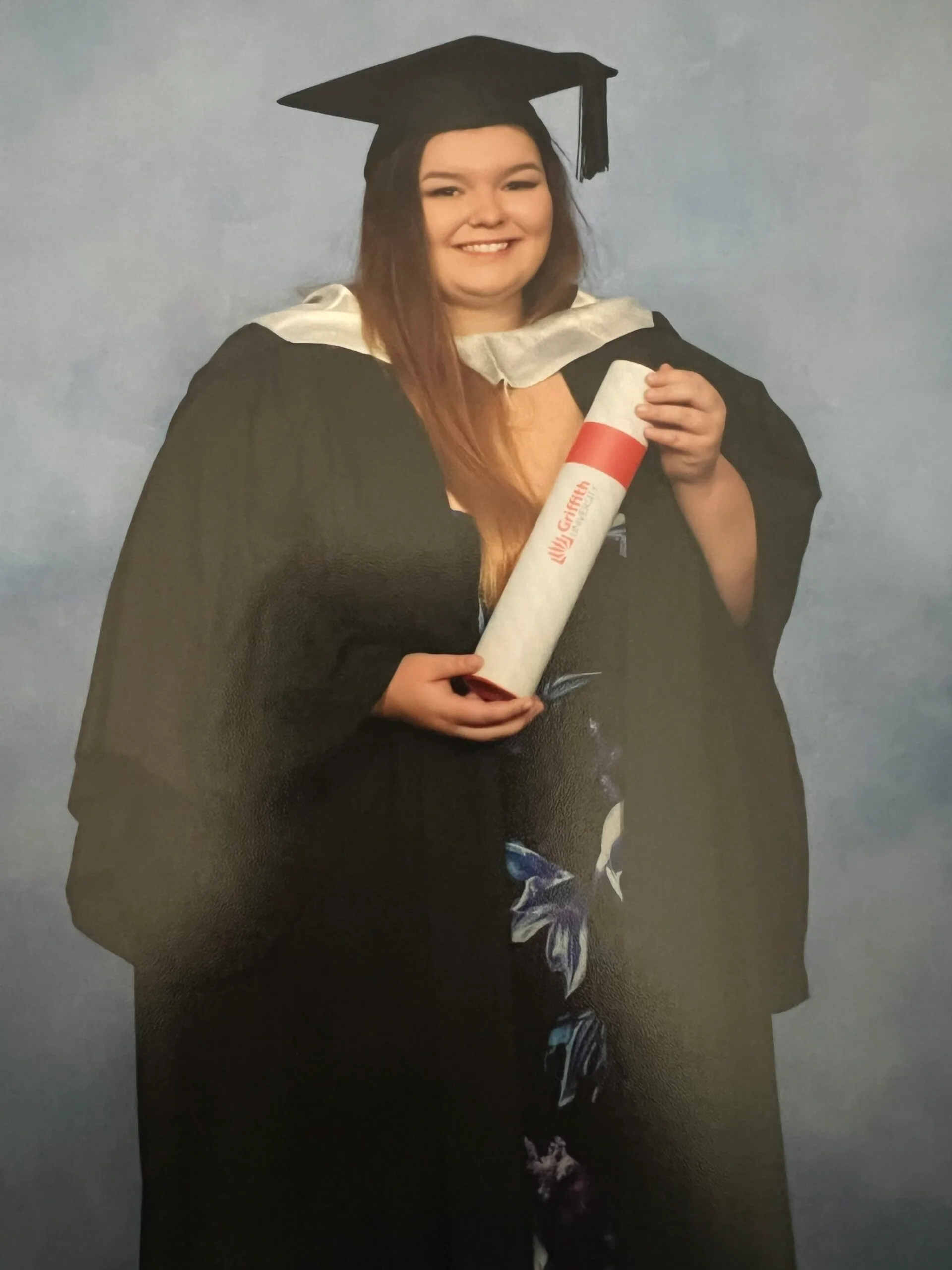 woman in graudation cap and gown