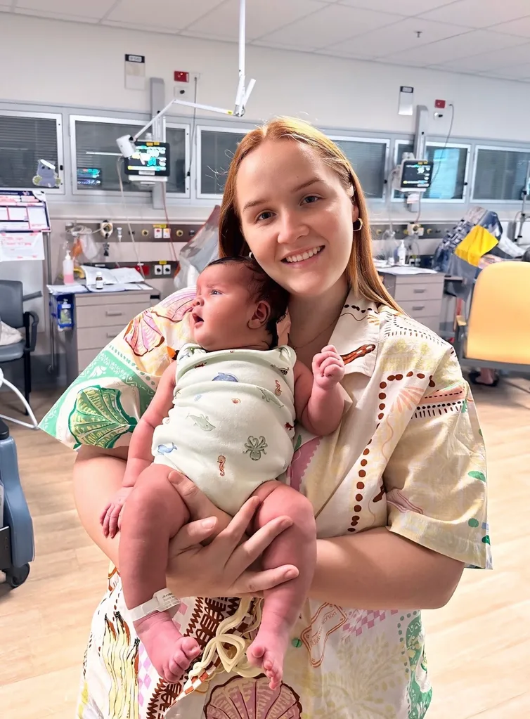 Image of mum holding newborn son