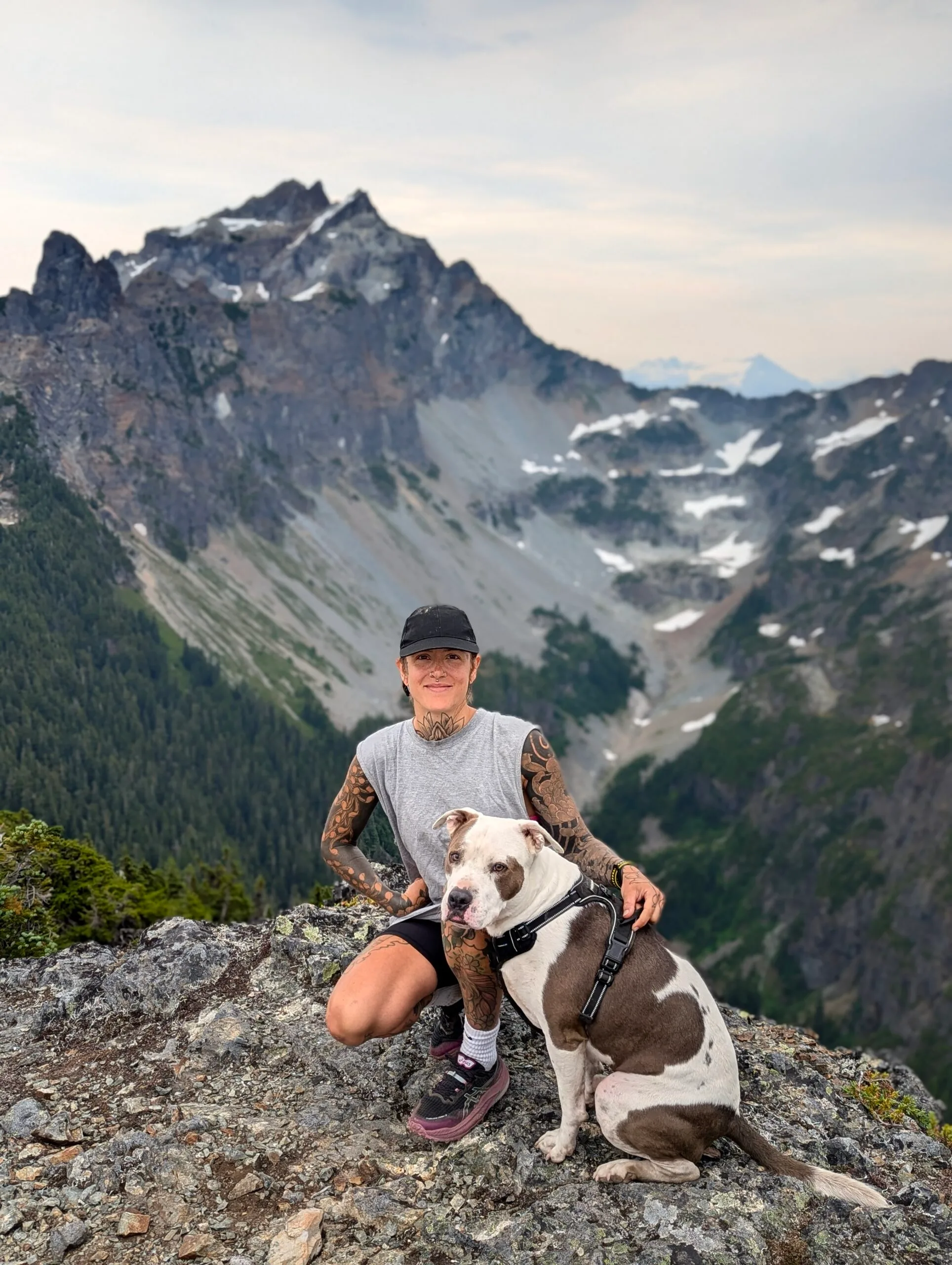 Image of woman and dog on a hike