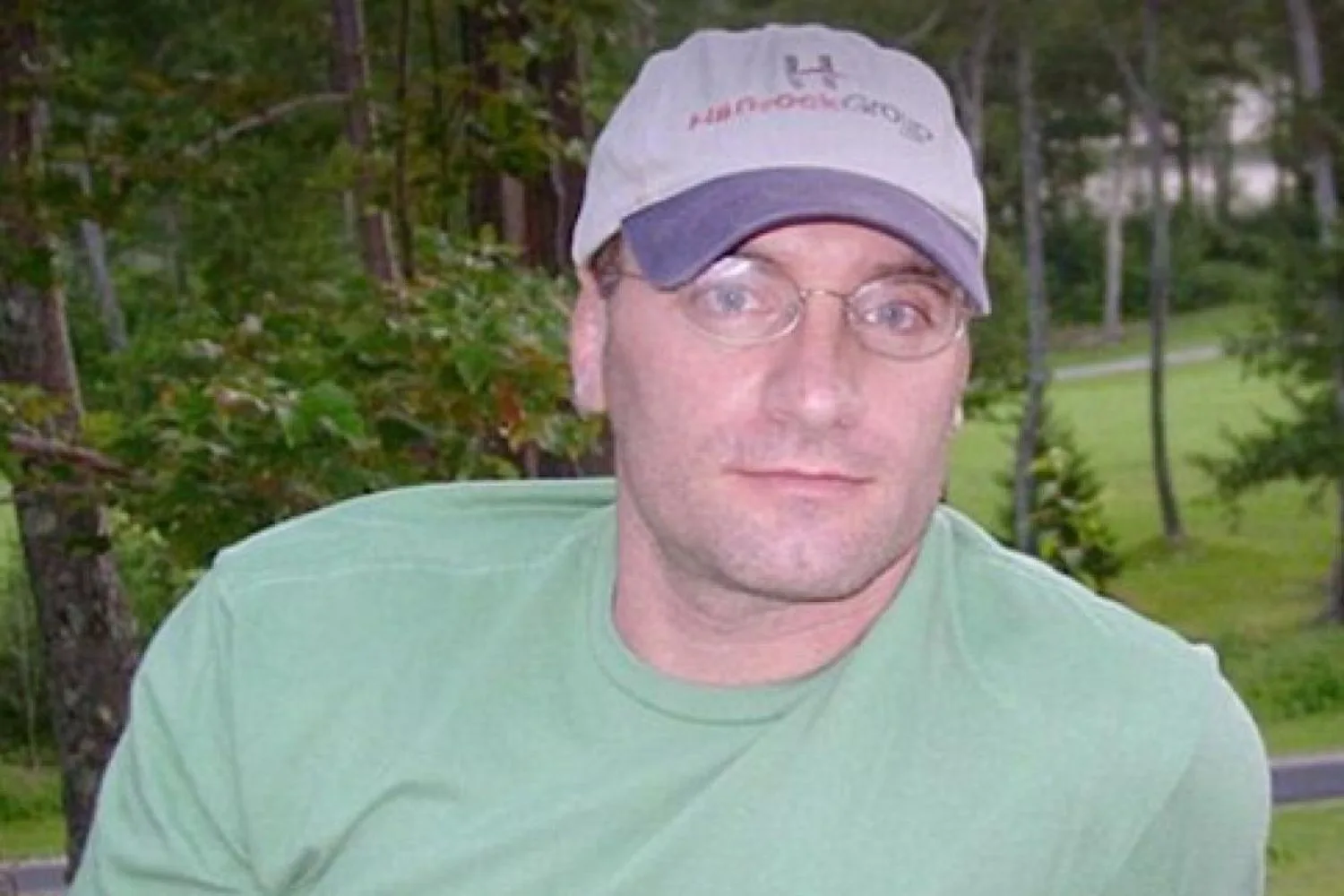 Rob Kissel outside wearing cap and t shirt and glasses