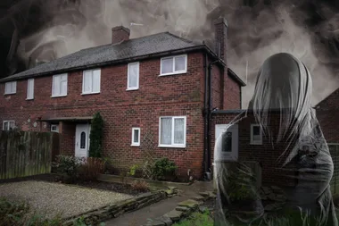 Semi detached brick home with spooky sky and ghost fifure in front