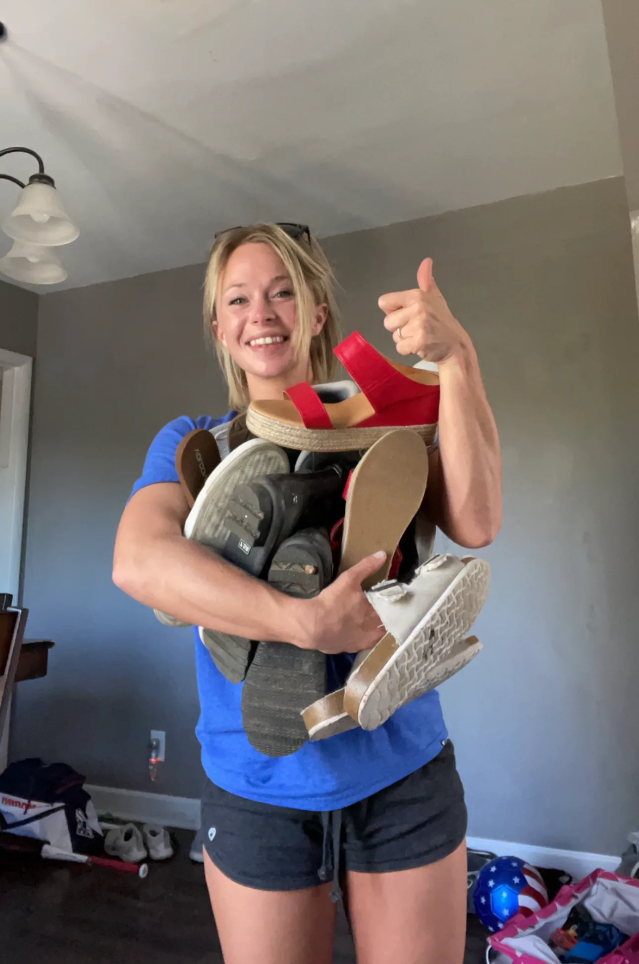 Image of woman holding shoes