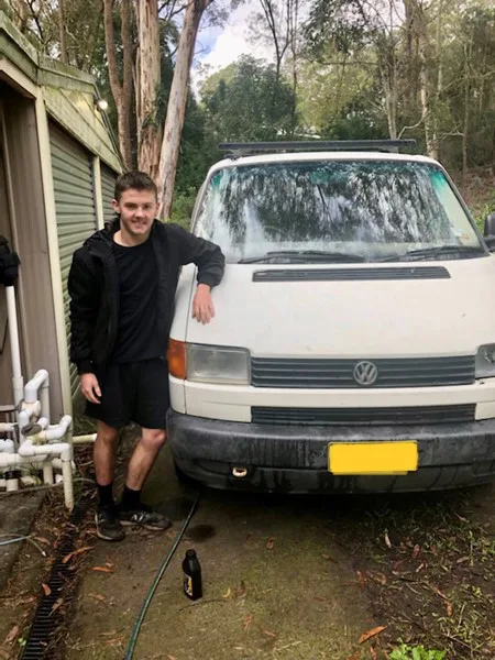 kid next to first car, car is white 