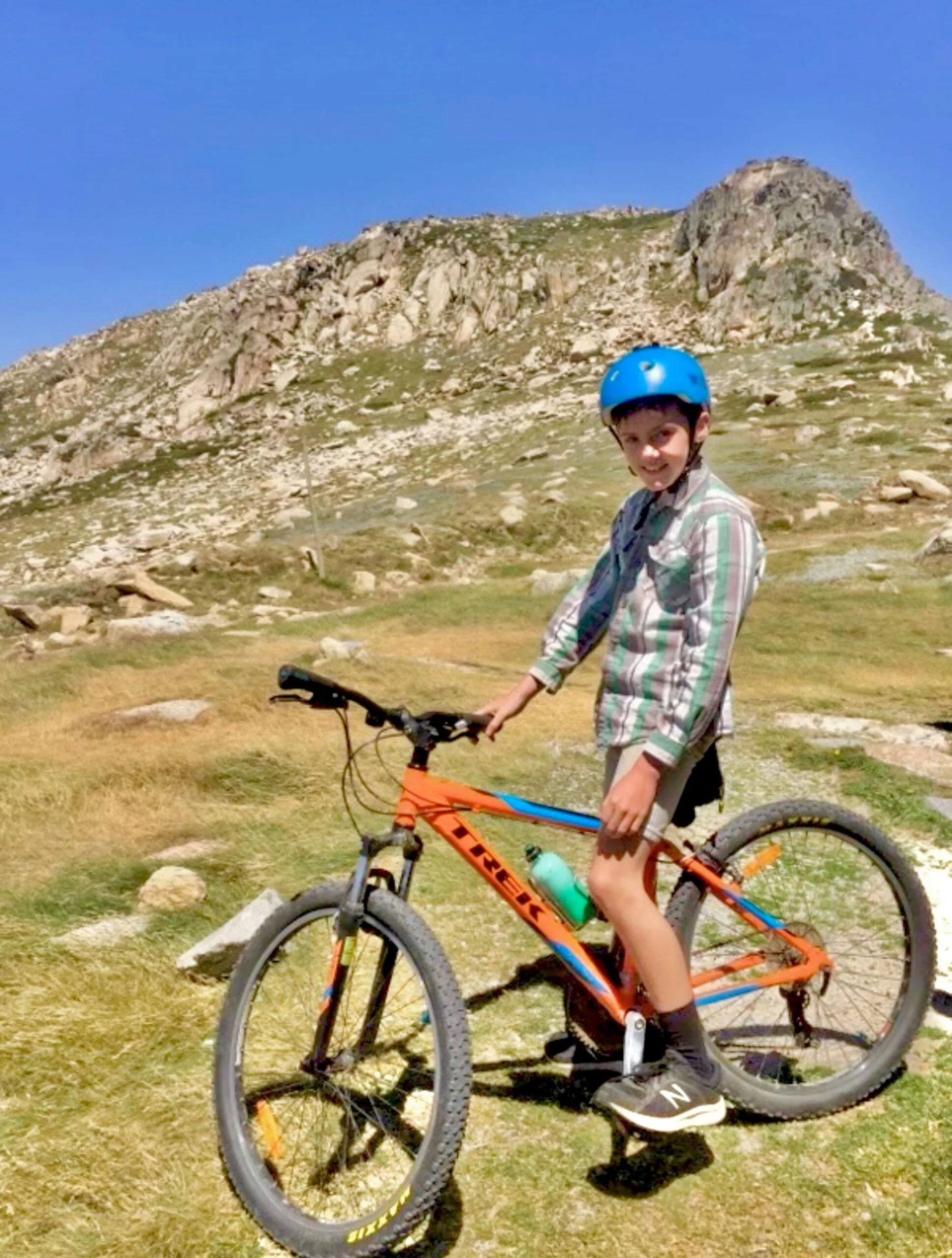 kids on a bike on a hill 