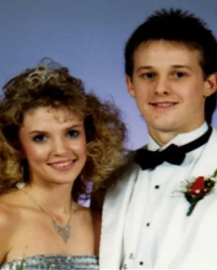 couple smile at formal event