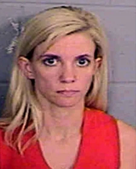 woman blonde hair and large eyes headshot