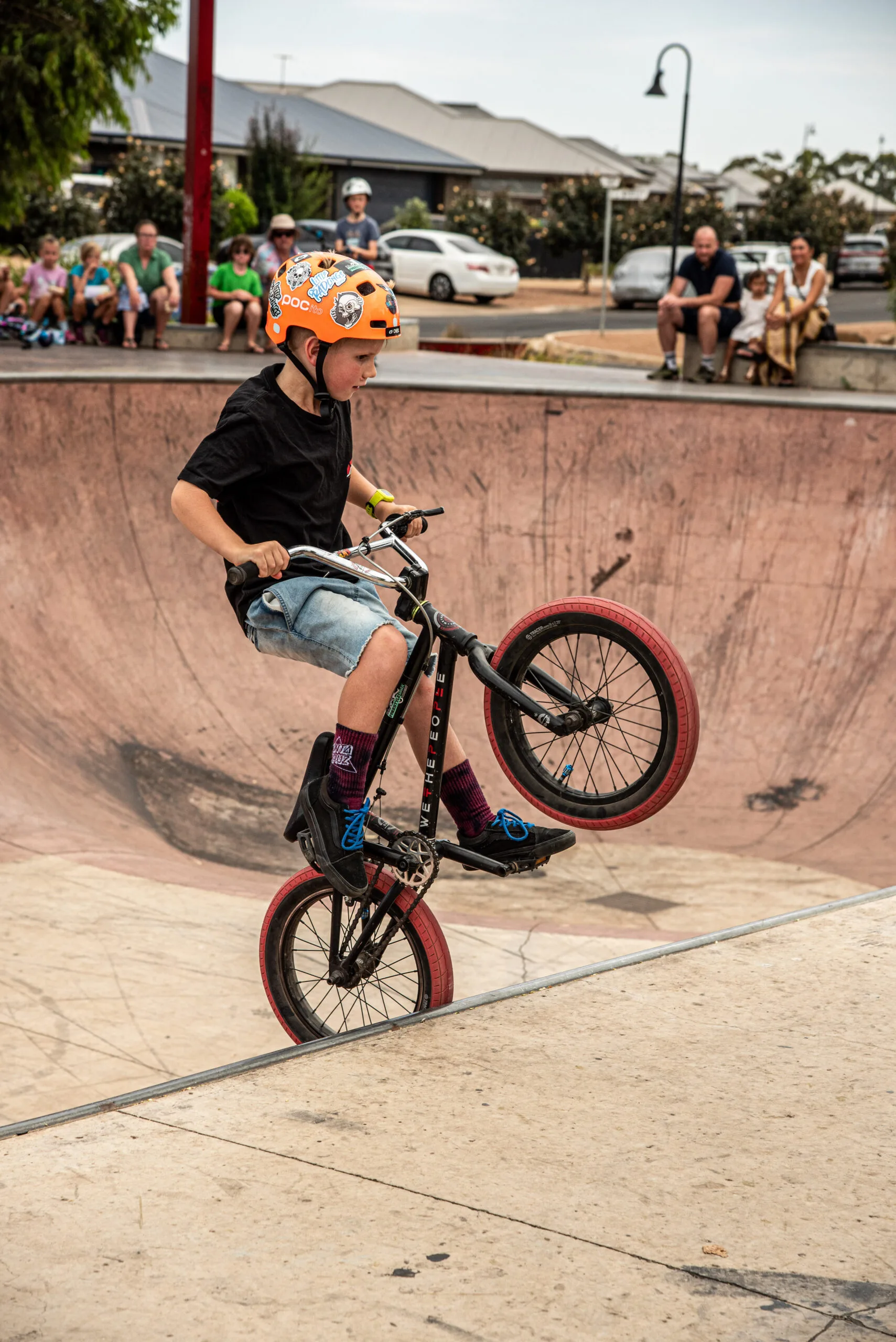 child riding BMX