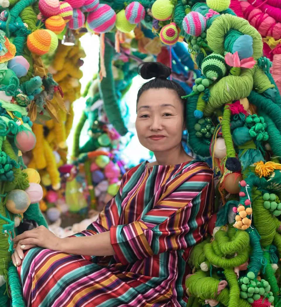 Image of woman surrounded by art