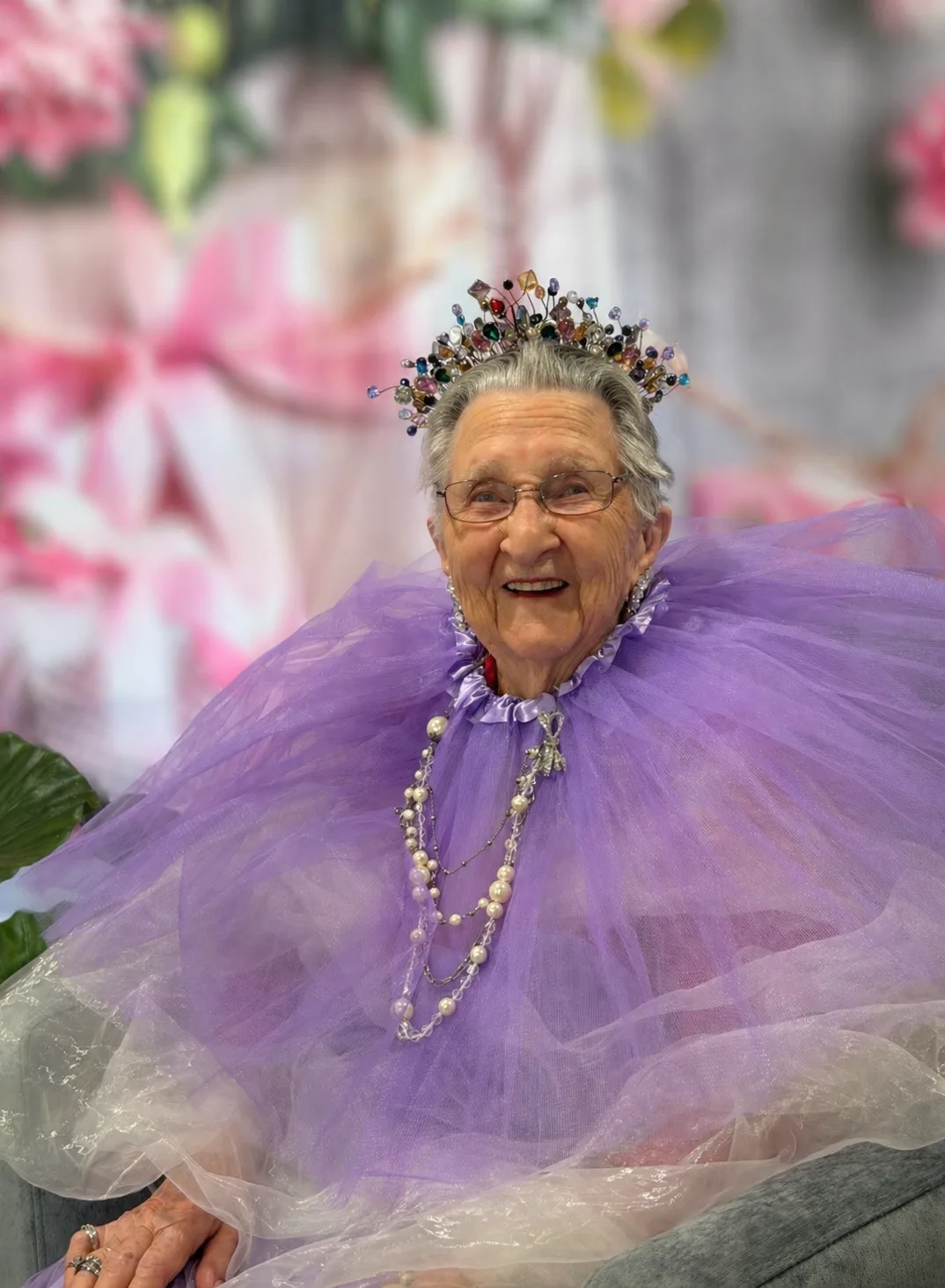 woman in purple with crown