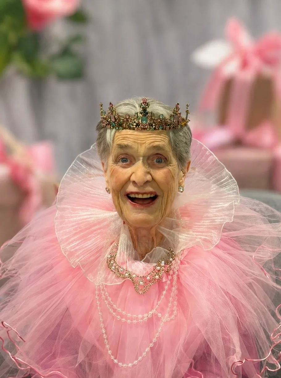 woman in pink with crown