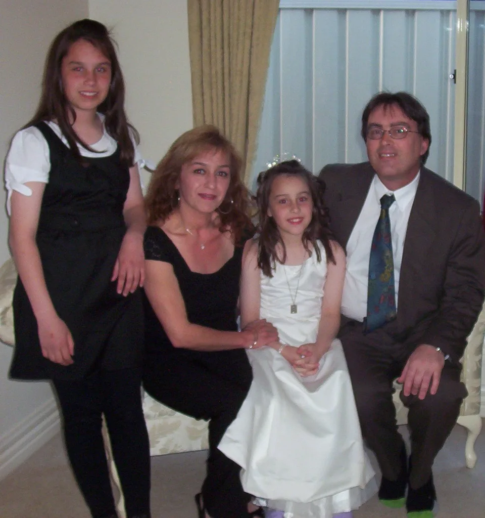 Image of mother, father and their two daughters