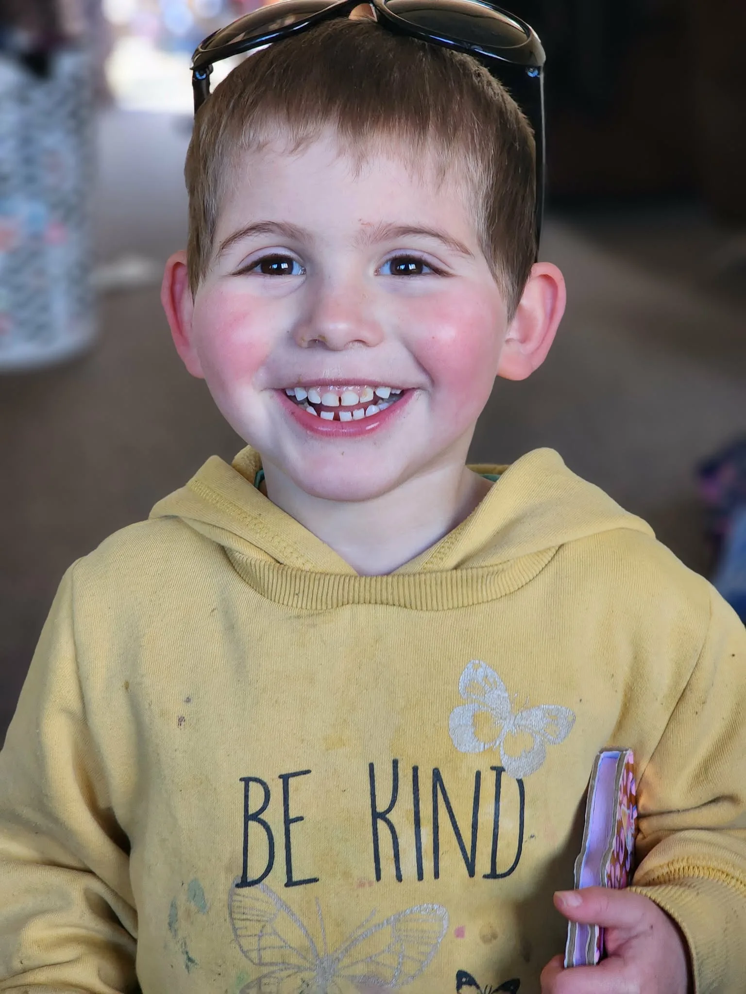 Image of young boy wearing yellow jumper