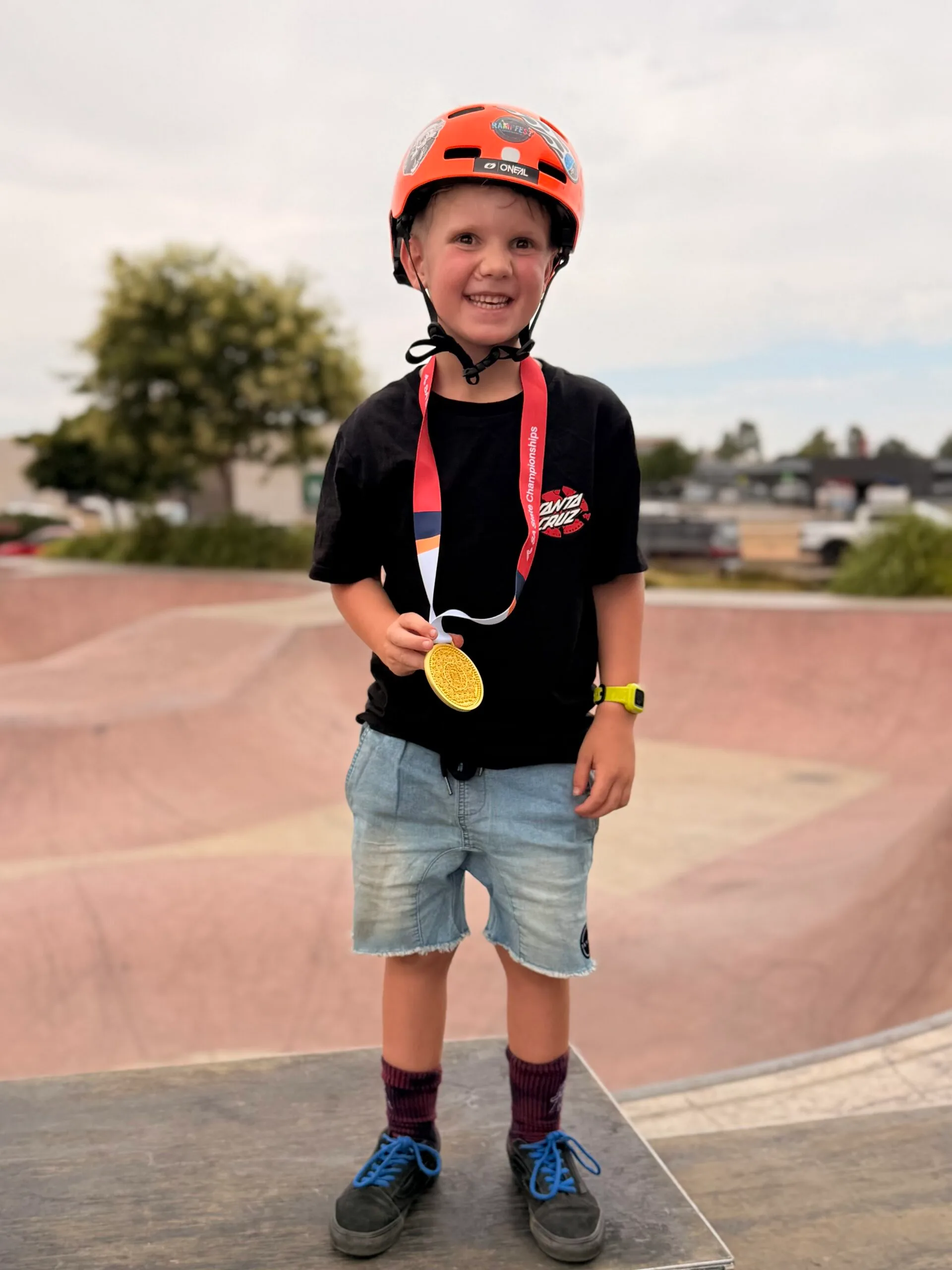 child with gold medal